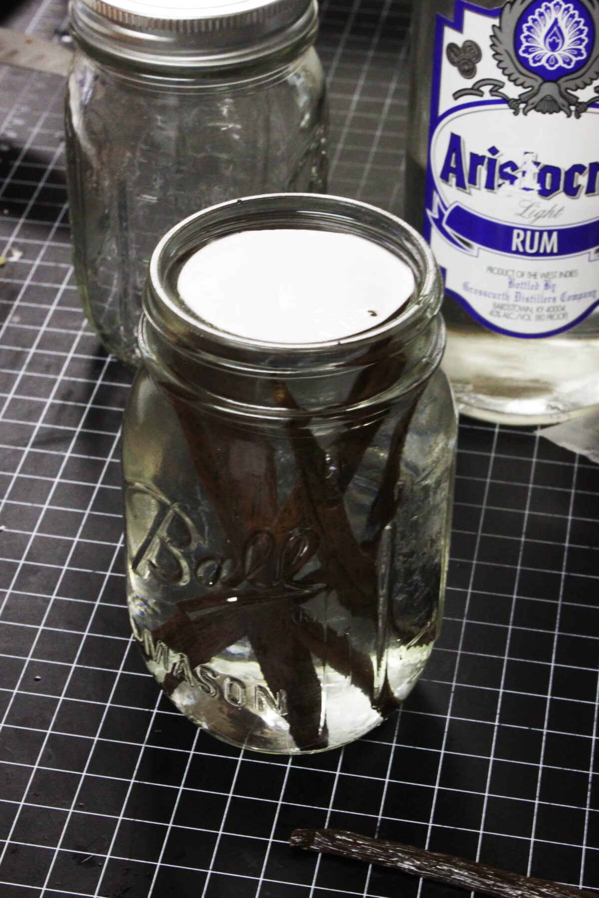 vanilla beans in rum in pint jar