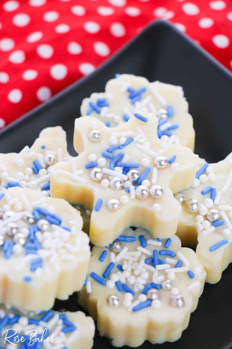 White chocolate fudge snowflakes with blue, white, and silver sprinkles