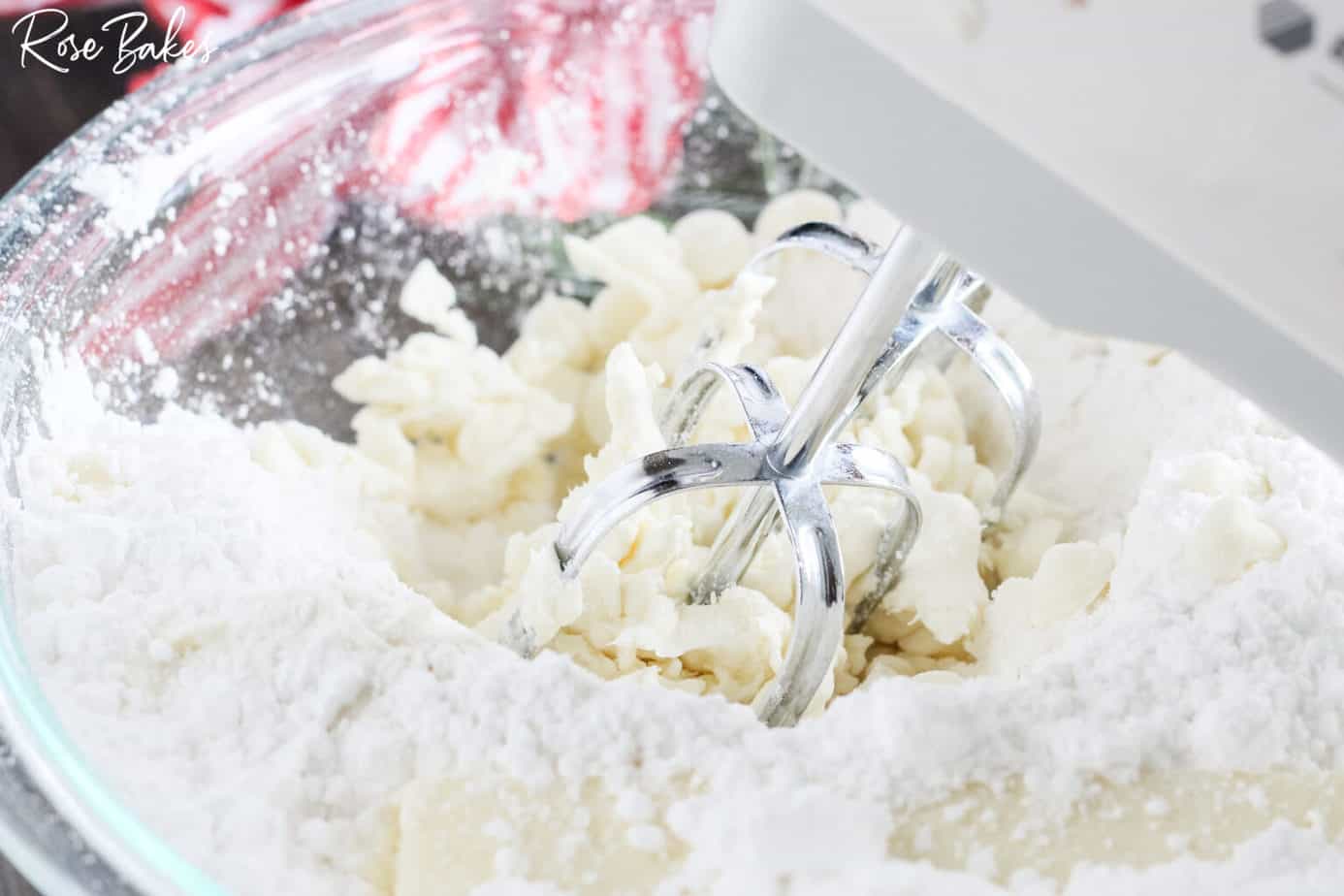 hand mixer combining sweet cheese ball ingredients