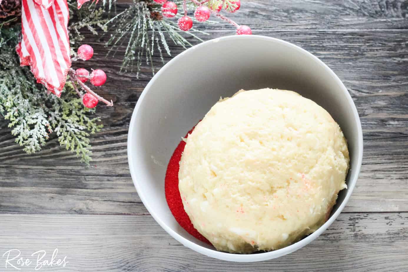 rolling cheese ball in red sugar