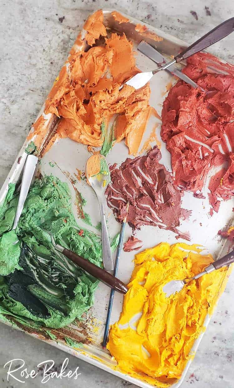 Cookie sheet with various colors of buttercream