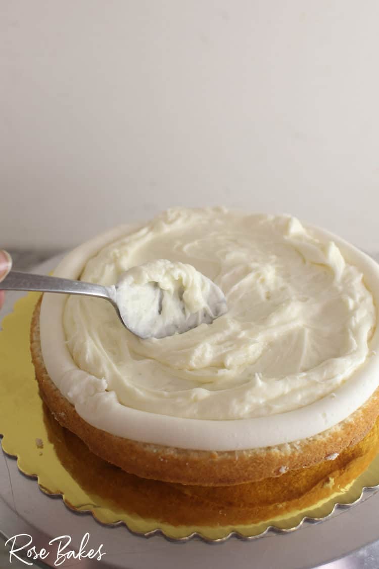 Spreading Chantilly Cream inside the layers of cake