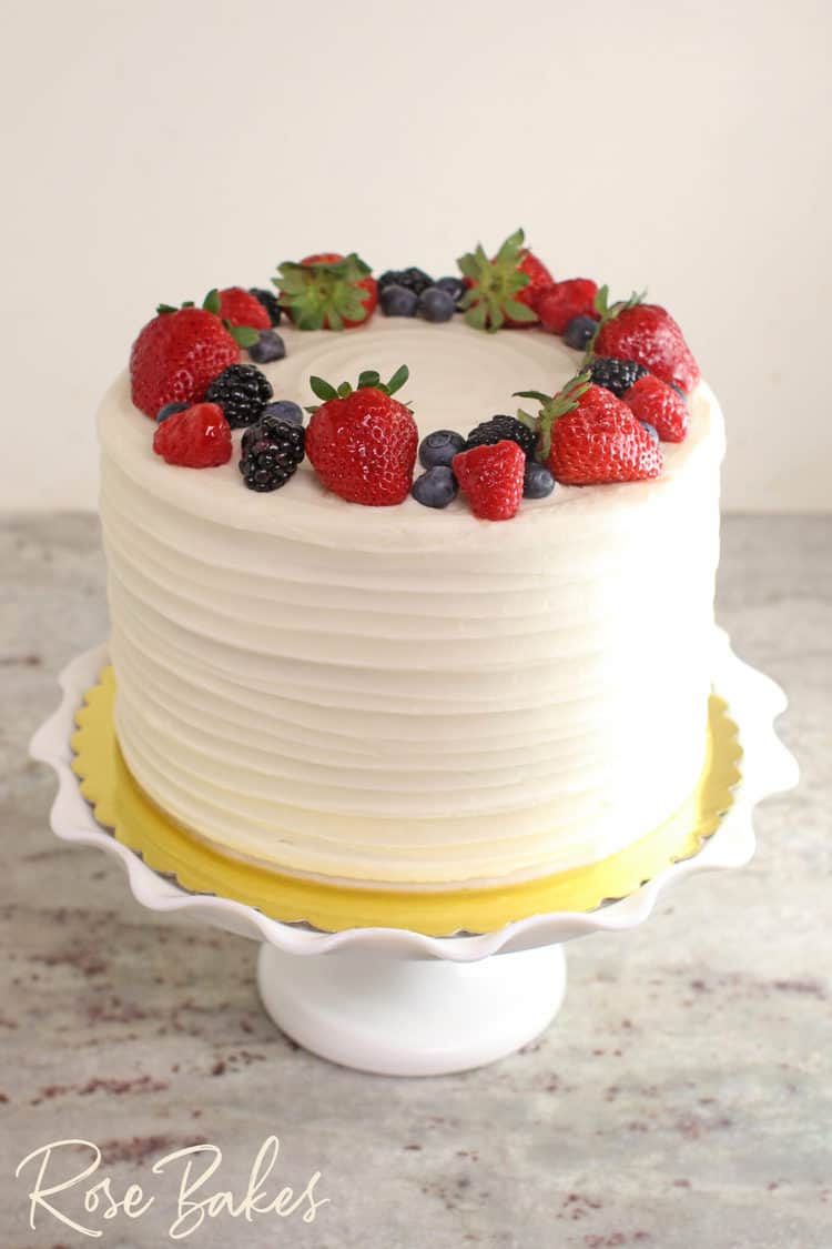 finished Chantilly Cake with a wreath of berries on top