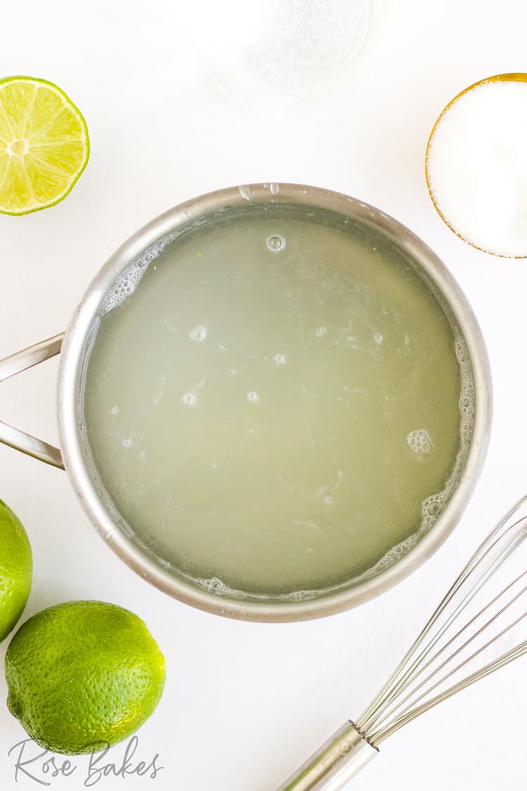 a silver pot filled with the water, sugar, and lime juice. The bottom right photo has limes, and the bottom right has a whisk.