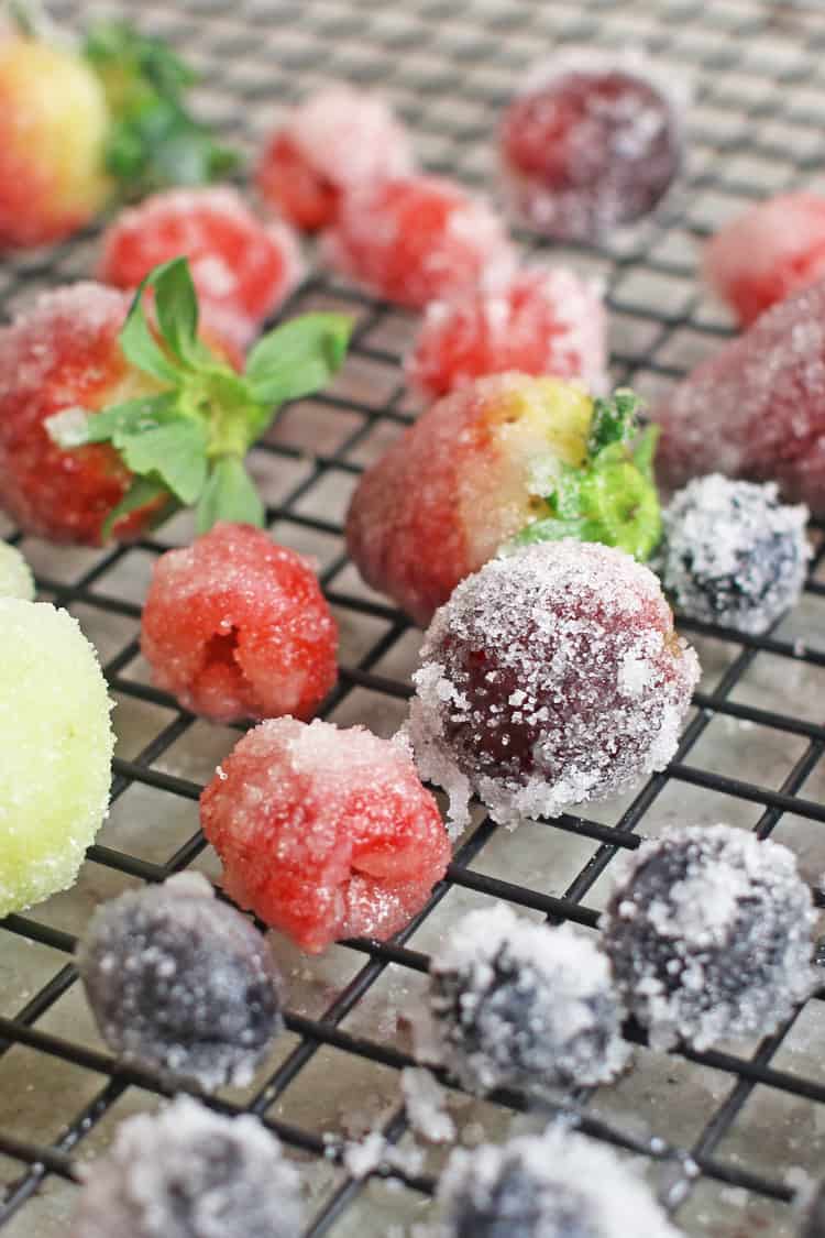Sugared berries and grapes drying on a rack