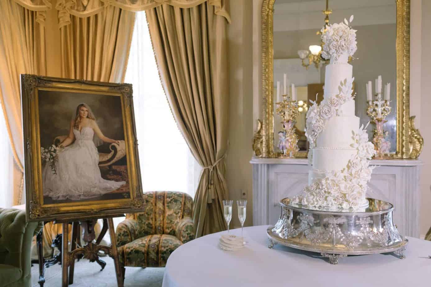 9 tier cake on table with bride photo to left