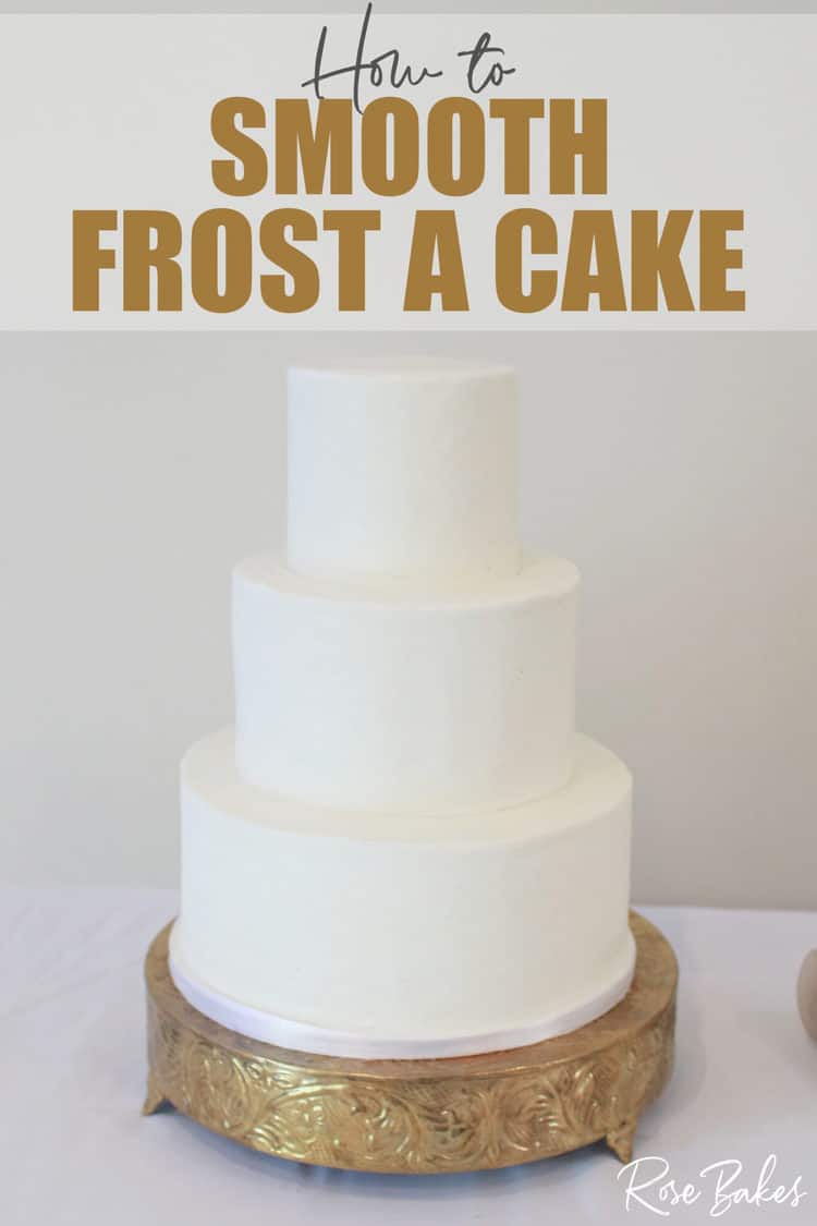 3 tier smoothed buttercream cake on gold cake stand with sharp edge 