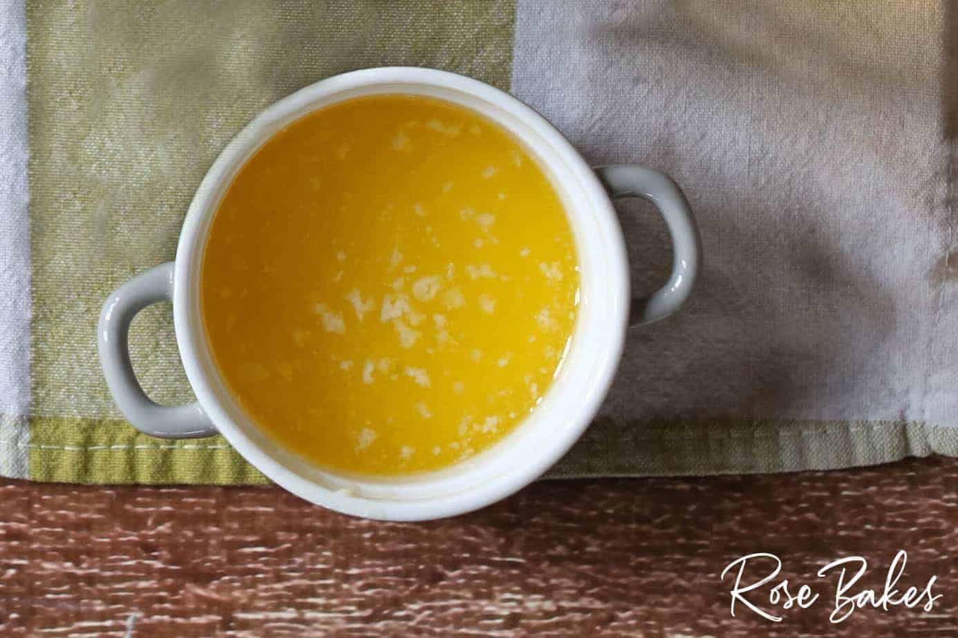 melted butter in white measuring bowl