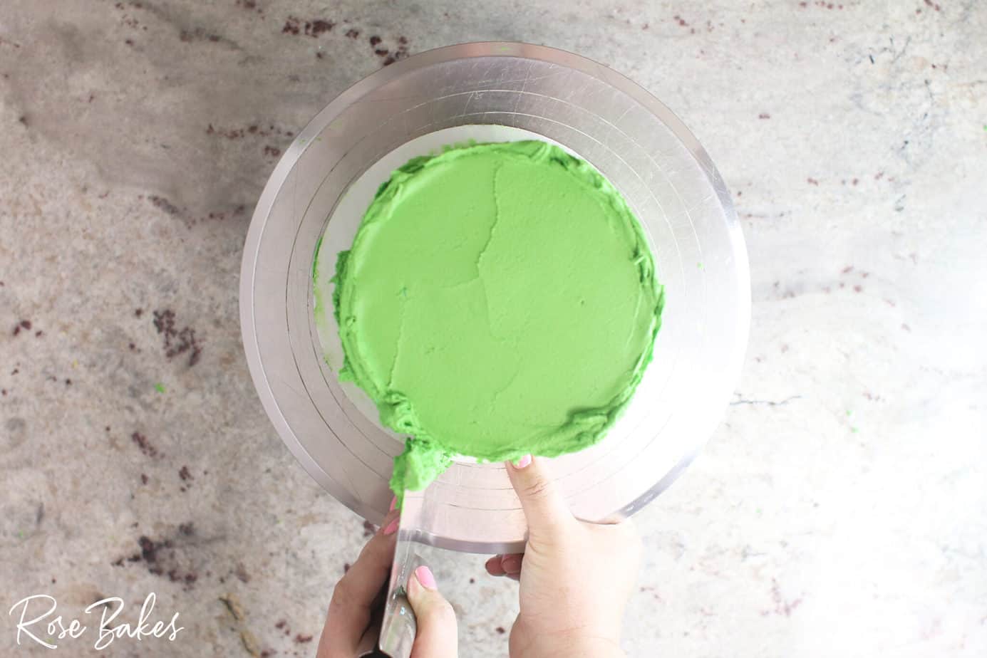 bench scraper smoothing green icing 