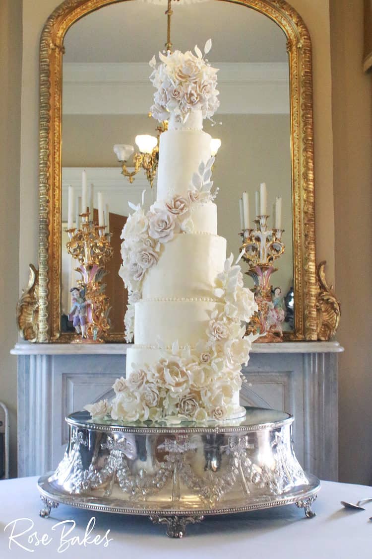 tall elegant luxury wedding cake with cascading sugar flowers