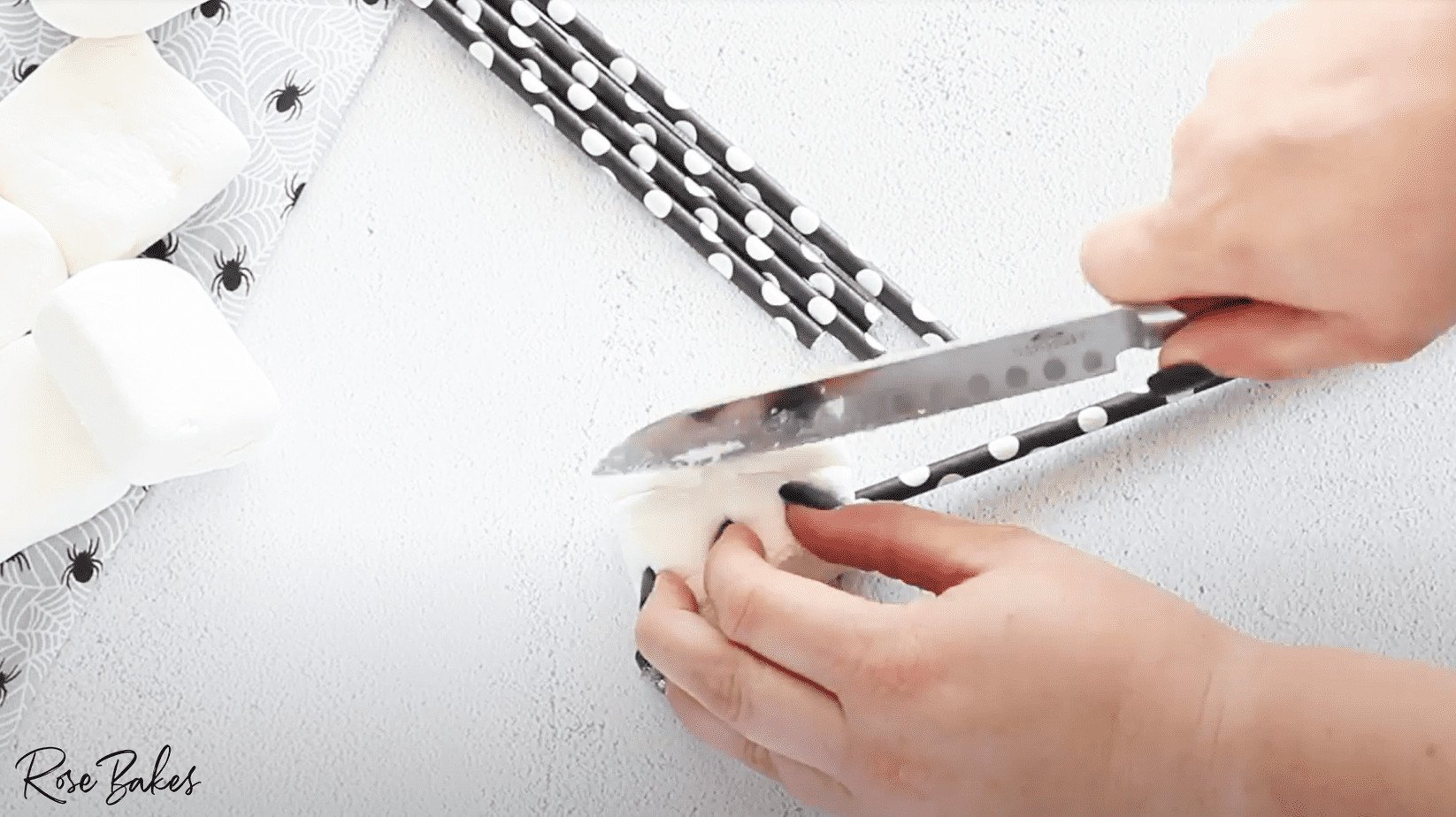marshmallow on straw being trimmed 