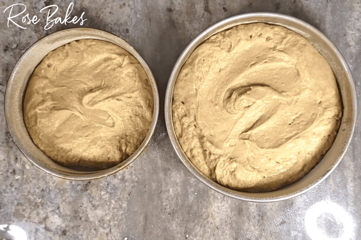 two cake pans with batter poured in