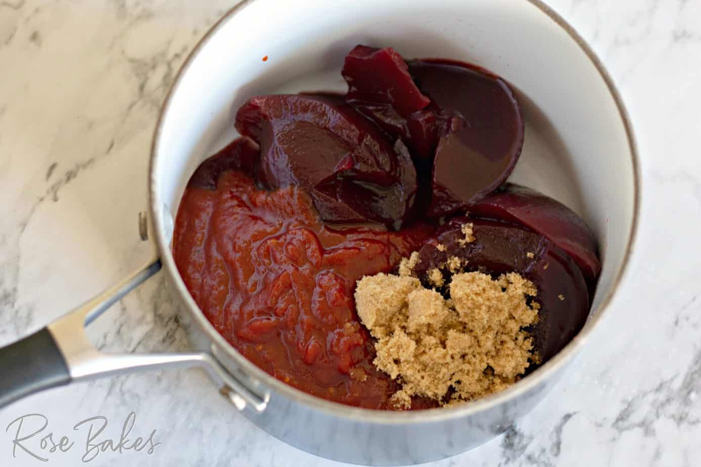 Ingredients for the cranberry bbq sauce in a saucepan.