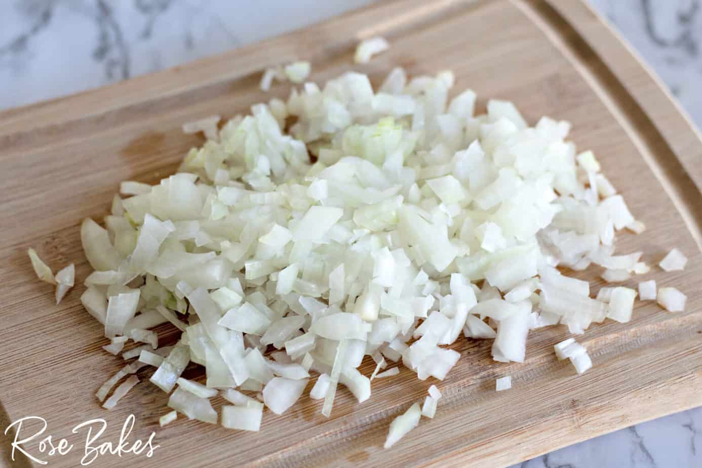 chopped onion on a cutting board