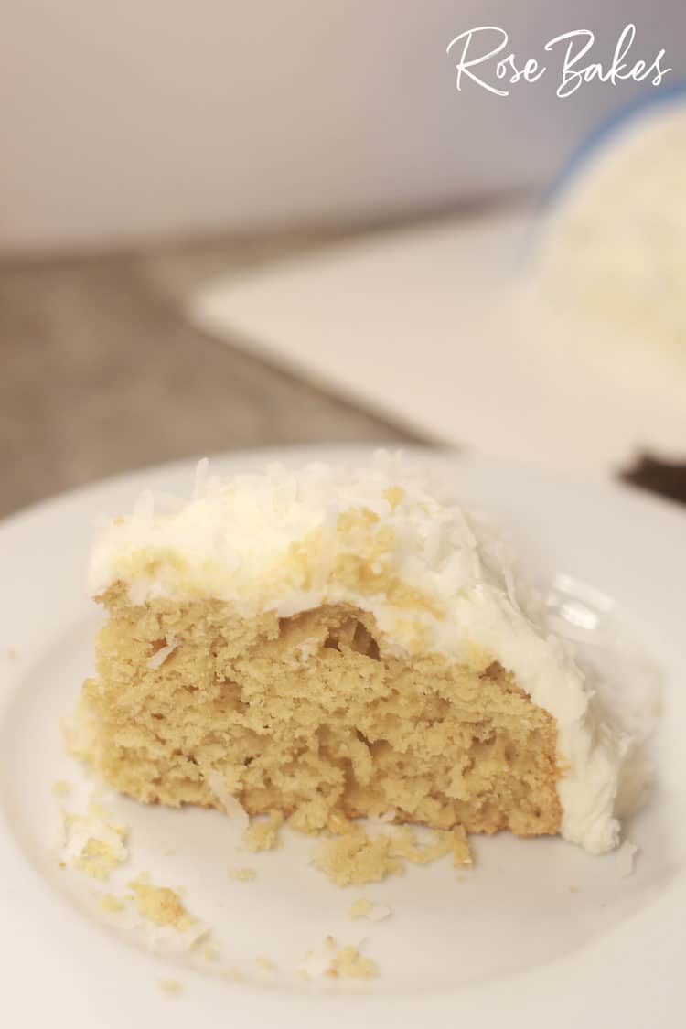 Gluten free coconut cake decorated like snowman slice of cake