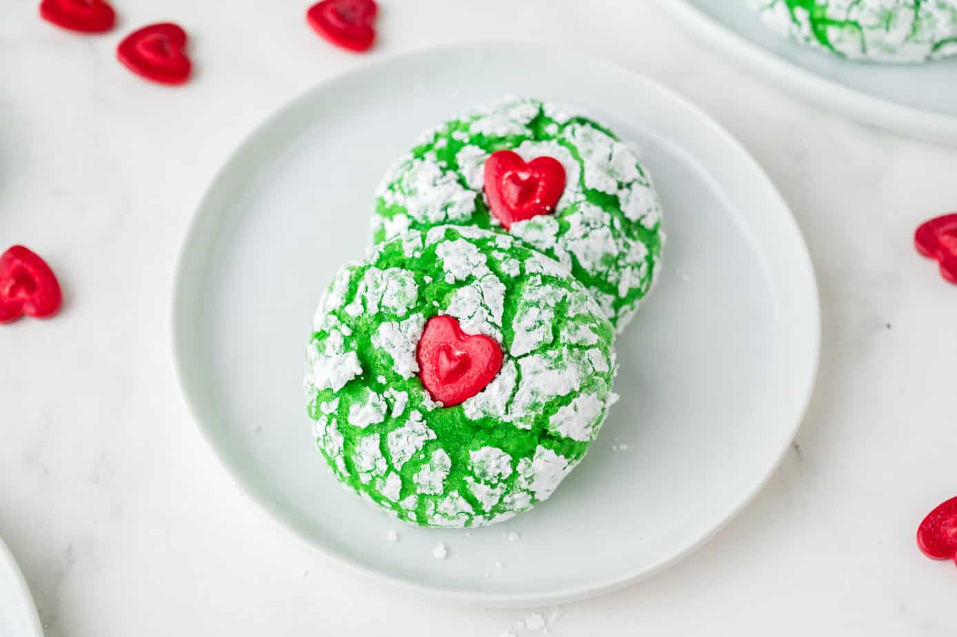 Green Grinch Cookies with Red Hearts in the middle