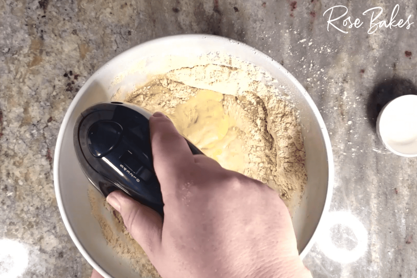 using hand mixer to combine ingredients