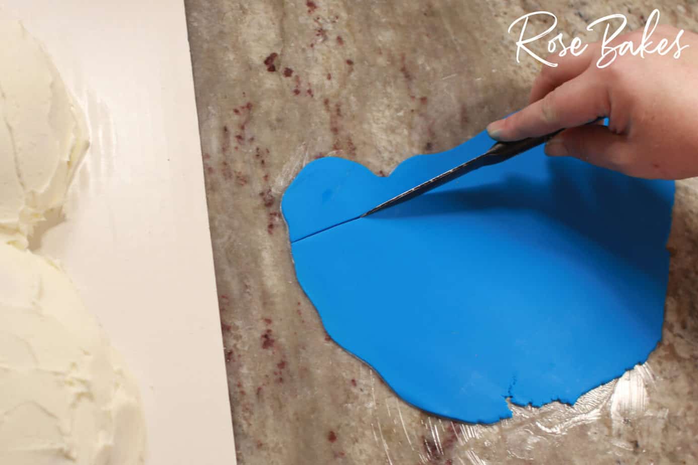 blue fondant being cut