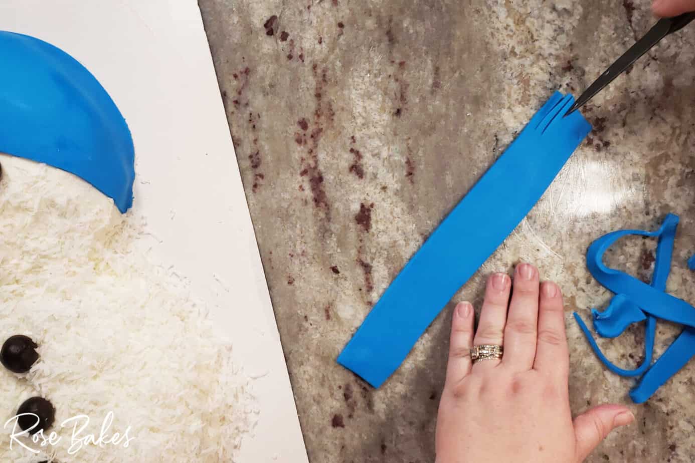 blue fondant being cut into strips