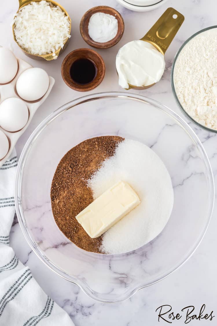 Sugar, coconut sugar, and butter in a clear mixing bowl
