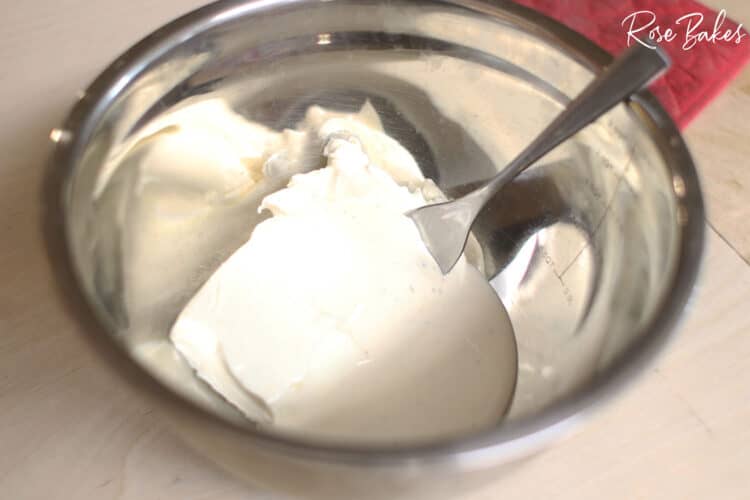 cream cheese block in metal bowl