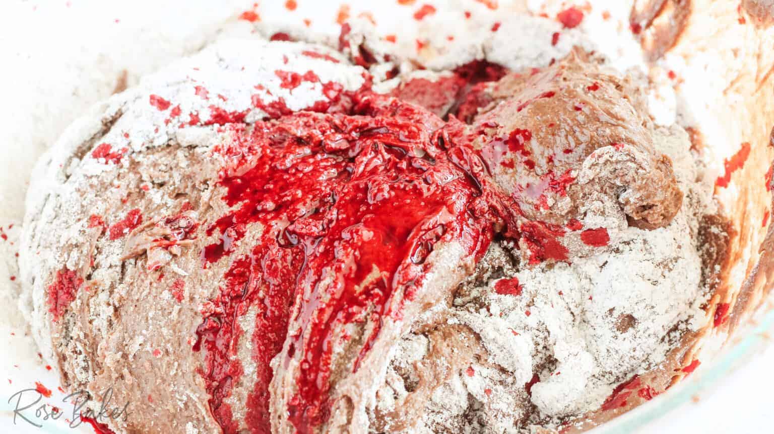 red food coloring being added
