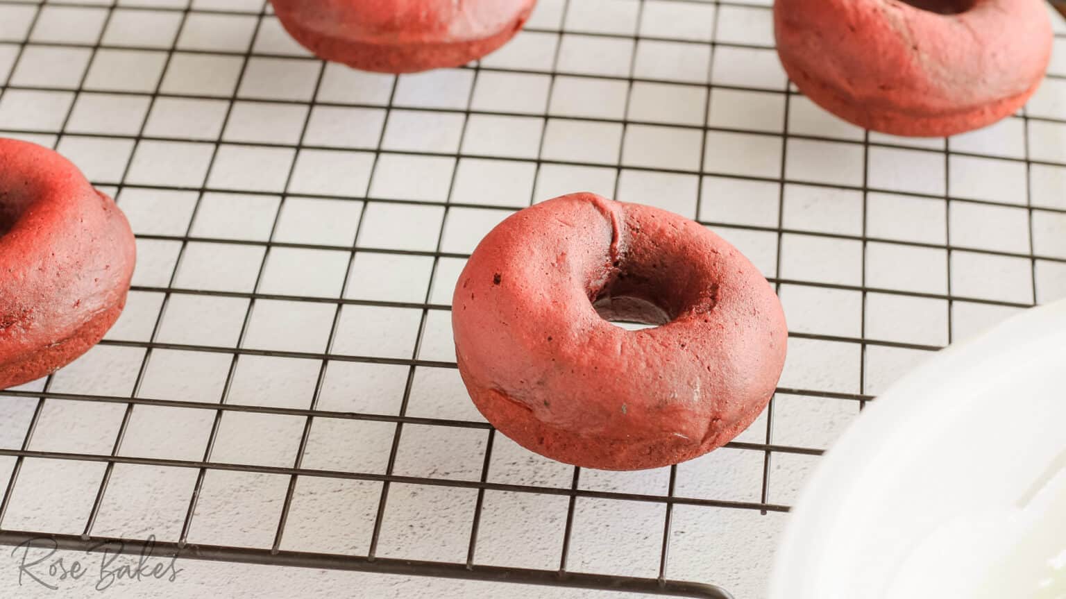 red velvet donuts on a cooling rack