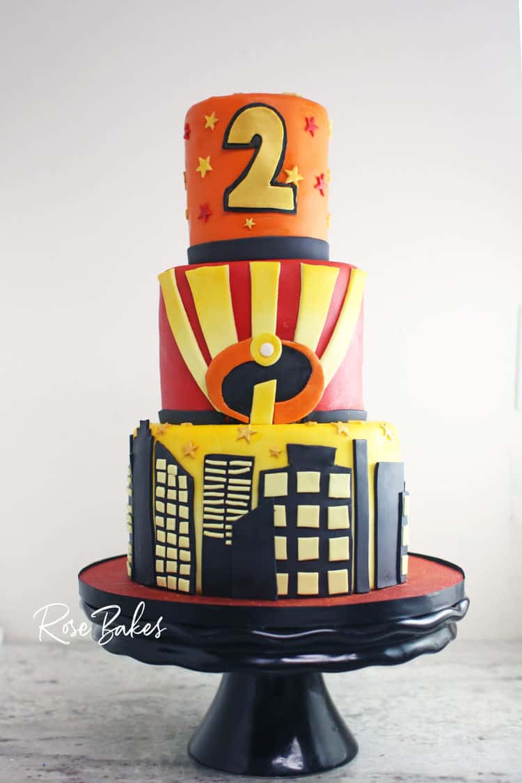 3 tier superhero cake pictured with neutral background
