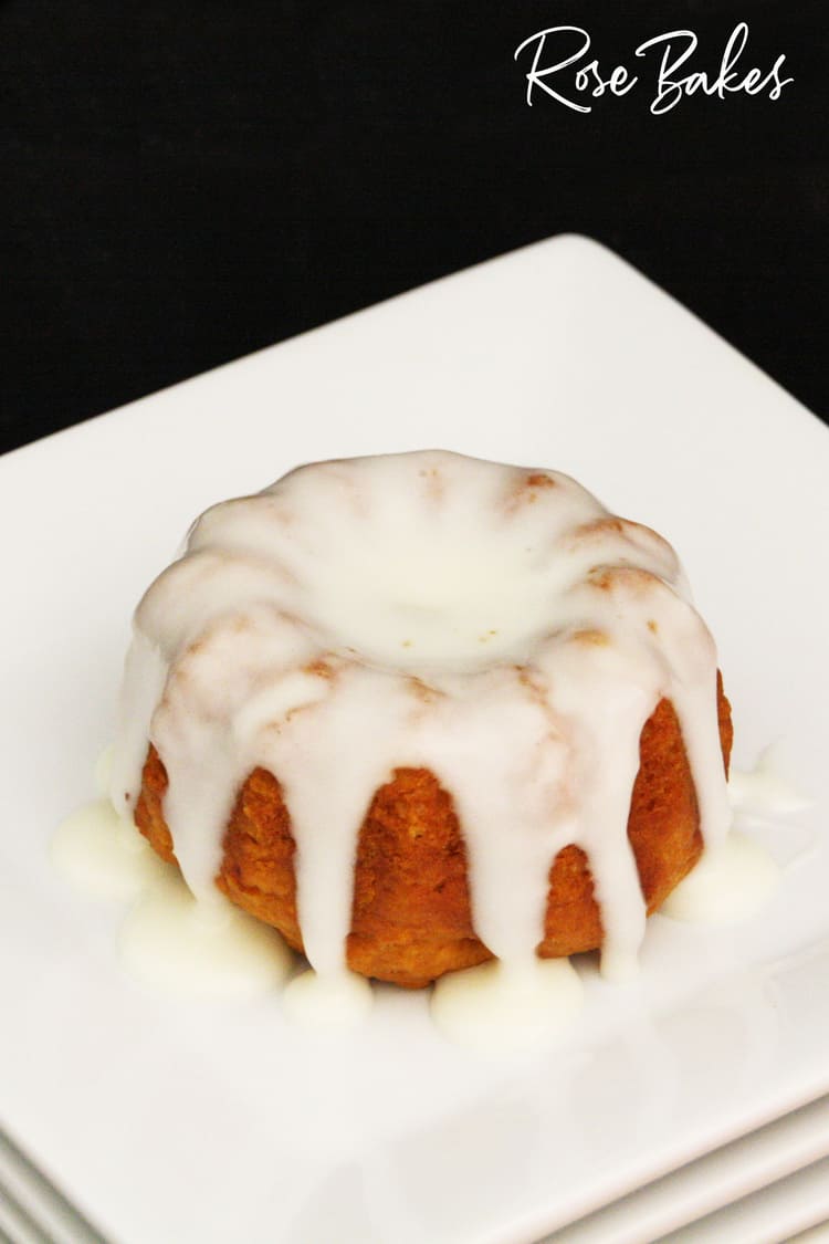 Pumpkin Spice Mini Bundt Cake with too much Cream Cheese Glaze up-close photo of pumpkin spice mini bundt cake with cream cheese glaze