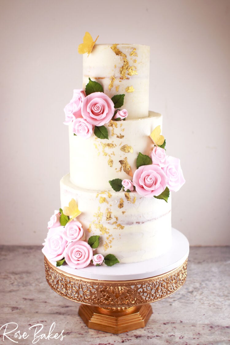 Naked-Wedding-Cake-with-Pink-Sugar-Roses-and-Gold-Leaf-and-Gold-Butterflies