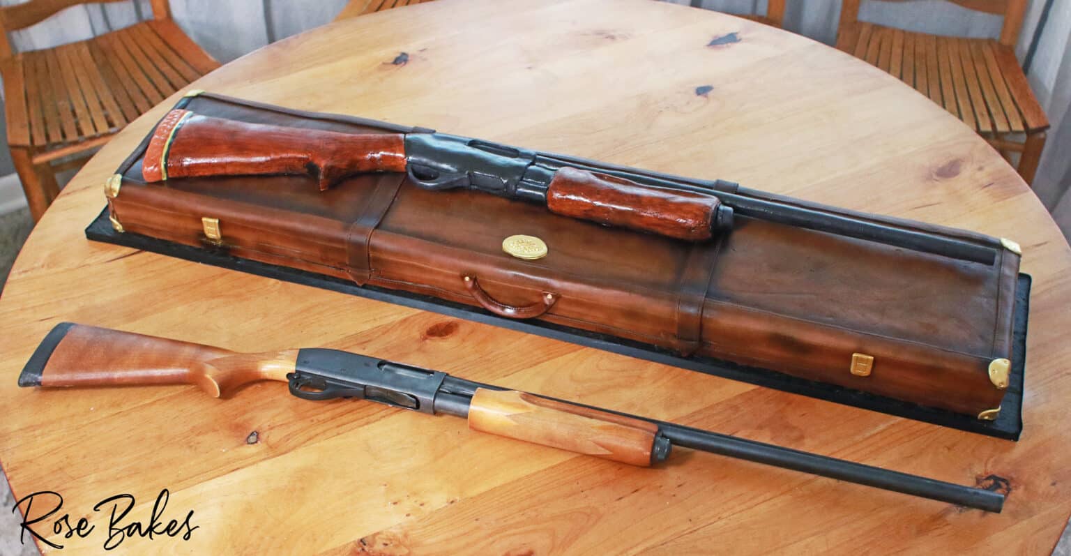 shotgun cake pictured next to actual shotgun for reference