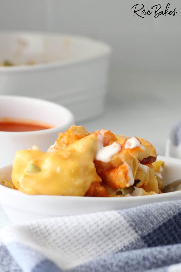 loaded buffalo cheese tik tok fries with chick-fil-a fries on white serving platter