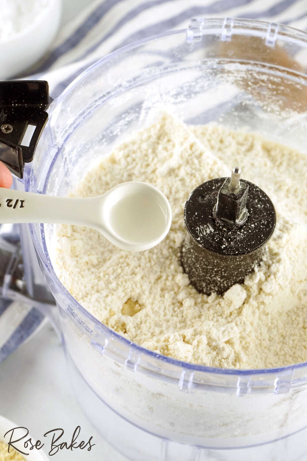 wet ingredients being added to dry ingredients in food processor