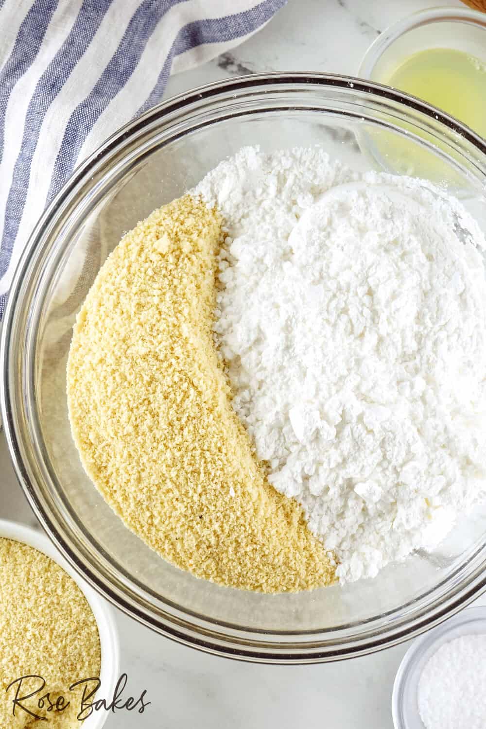 dry ingredients for homemade almond paste in clear mixing bowl