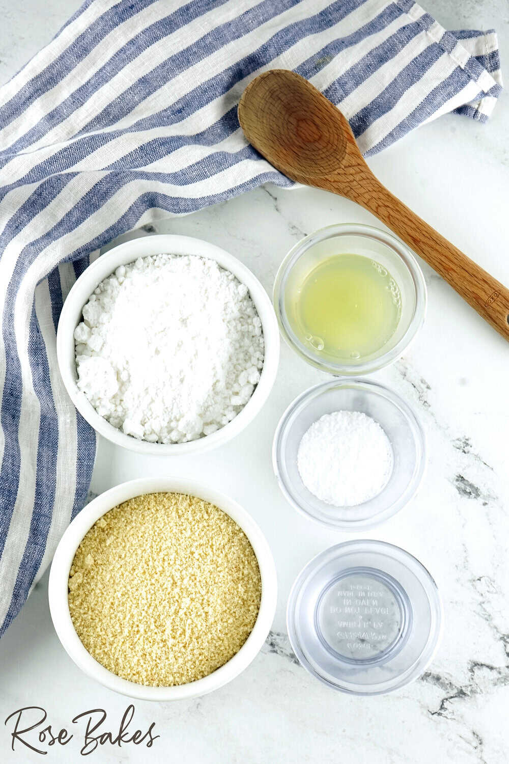 ingredients for homemade almond paste displayed in prep bowls