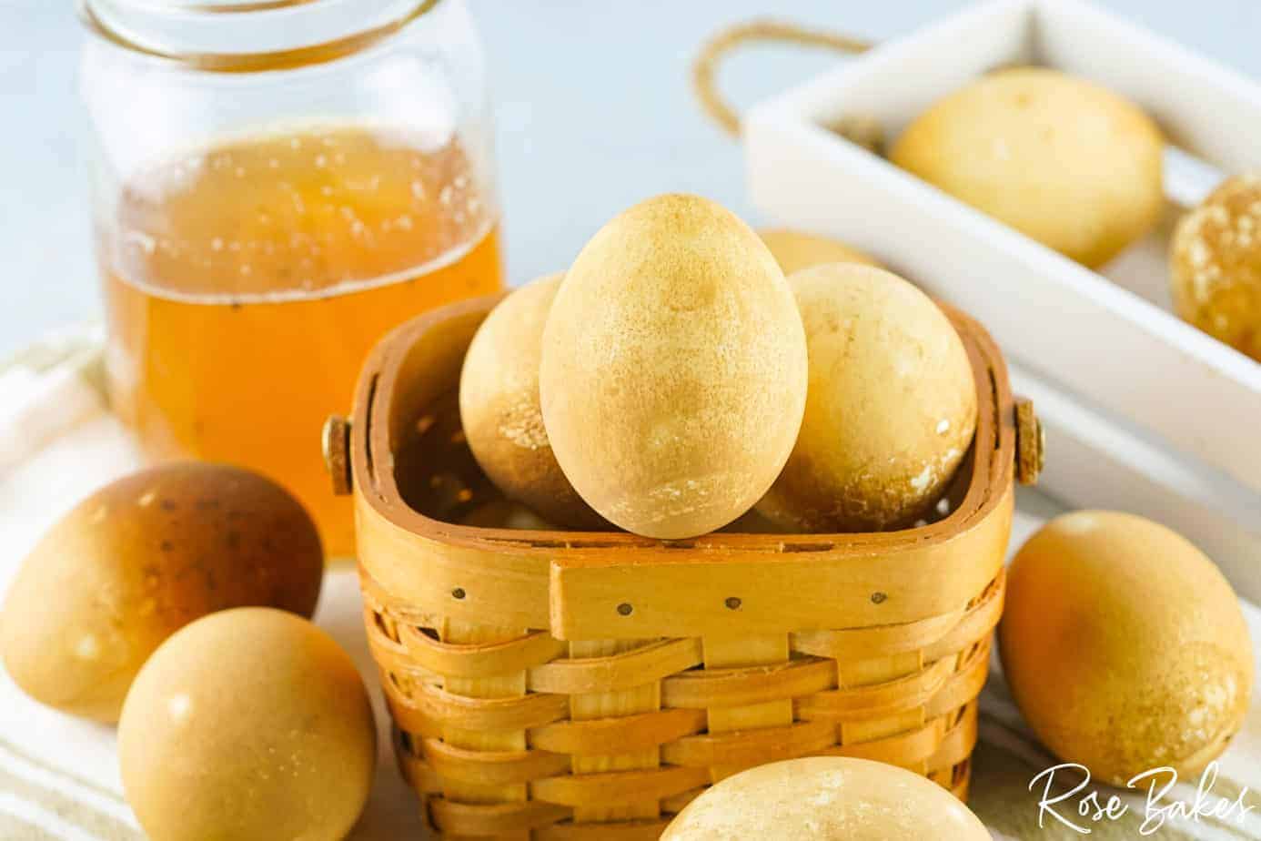 Easter Eggs Dyed with Black Tea in brown basket 