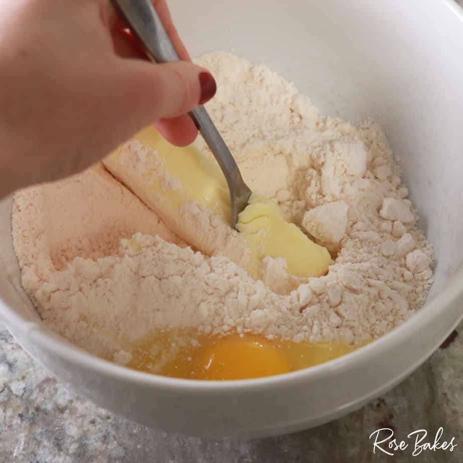 fork being used to cut in butter