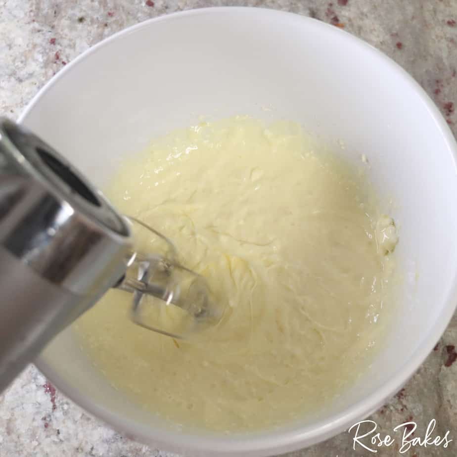 ingredients being combined using a hand held mixer
