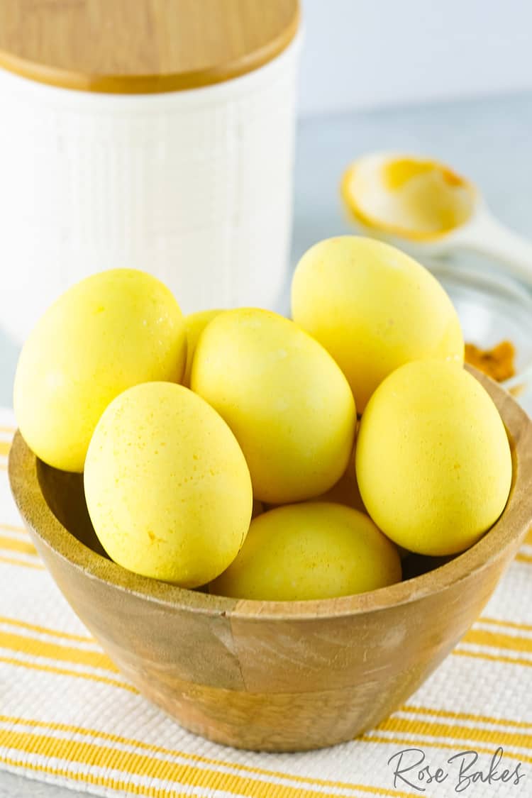 dyed easter eggs in wooden bowl