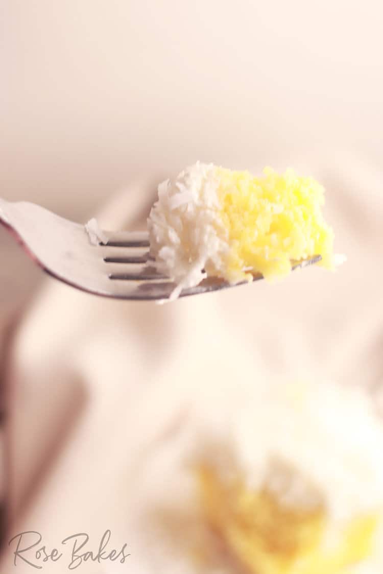 bite of coconut poke cake on a fork