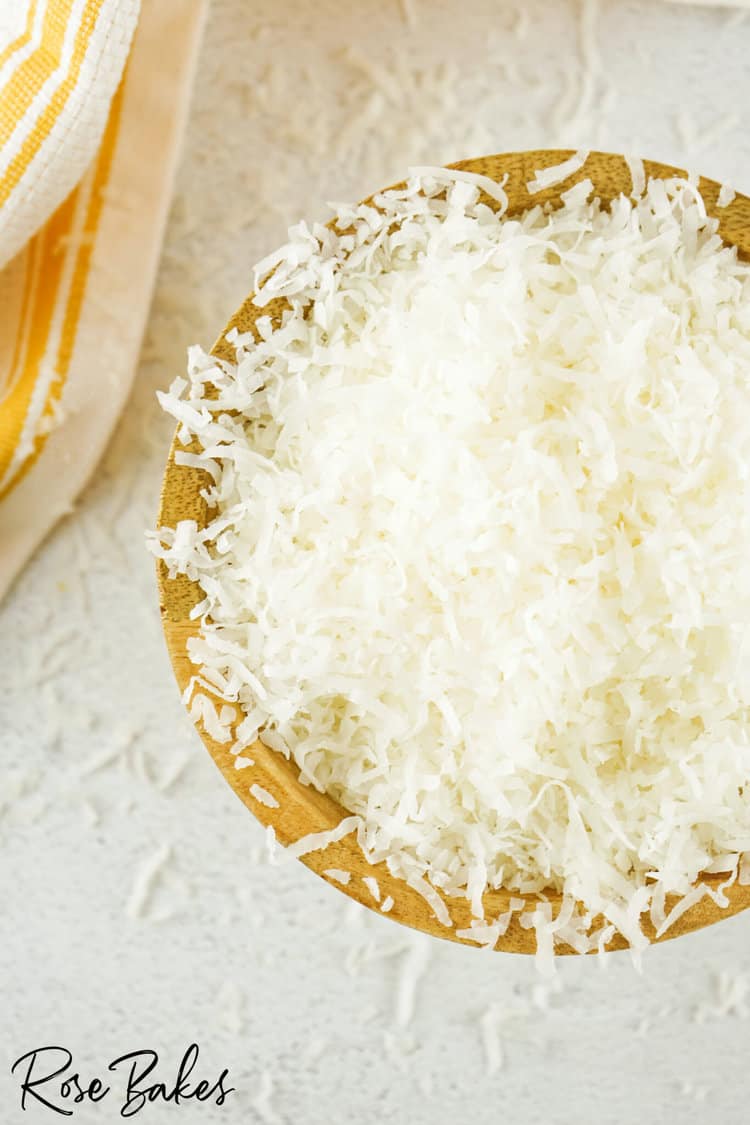 Wooden bowl full of shredded coconut