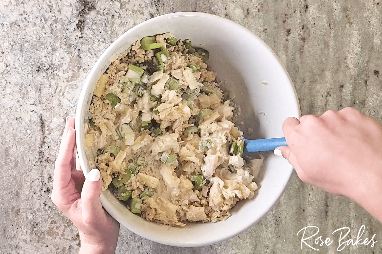 The salad being tossed together.