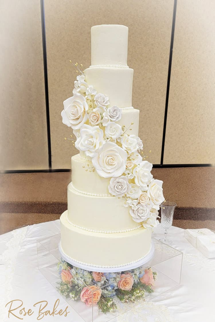 Wedding cake with cascade of sugar flowers