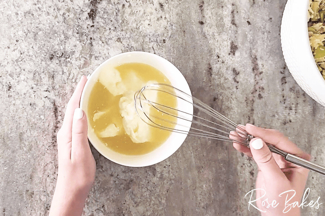 Mayo and pineapple juice being whisked together