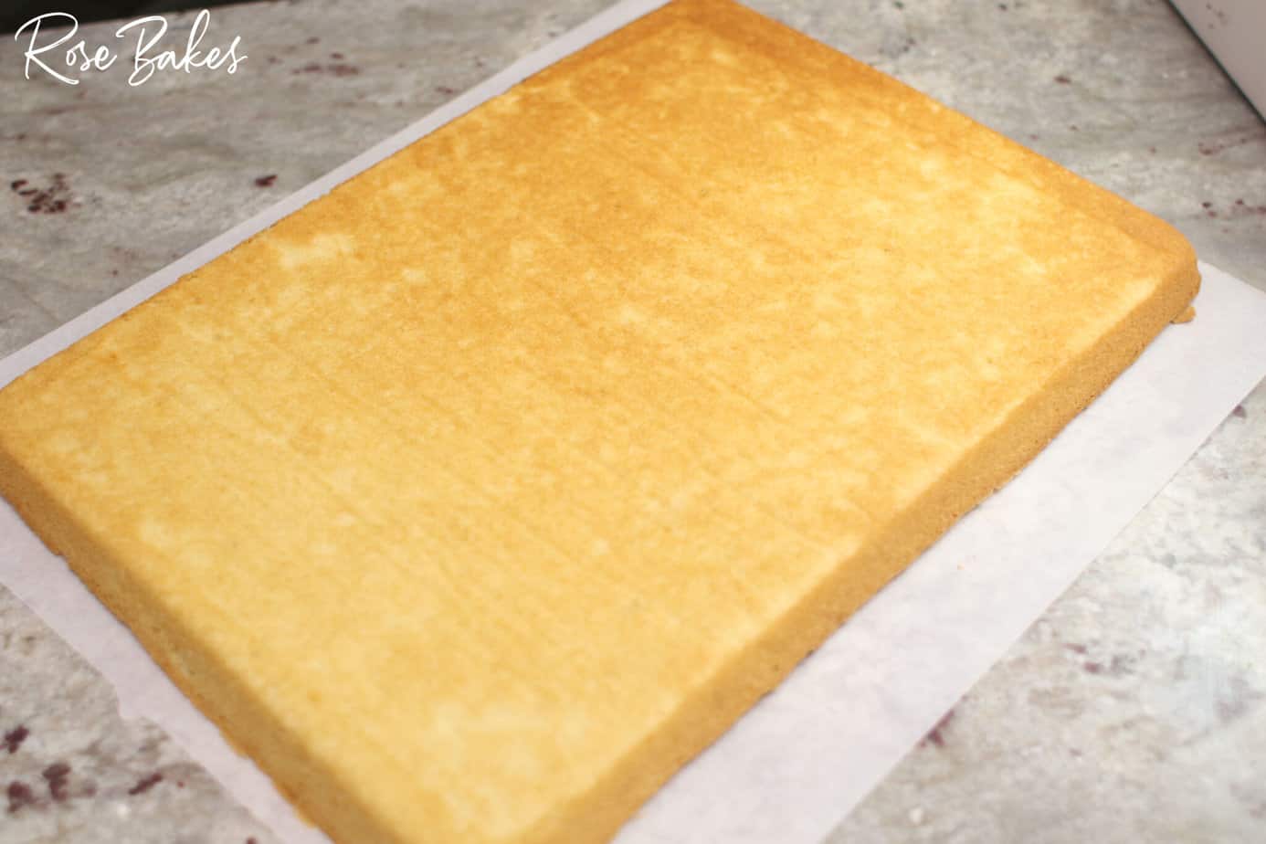 baked sheet cake on a piece of parchment