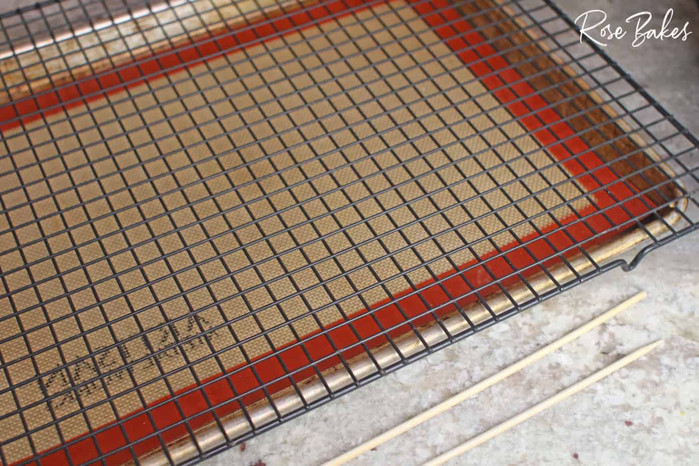 lined baking sheet with a wire rack on top of it.