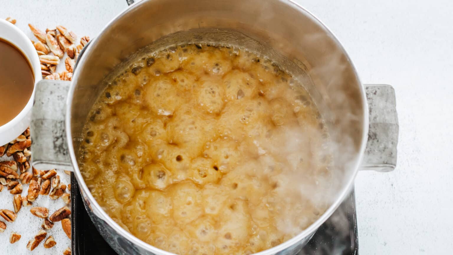 cooking praline candy in a saucepan
