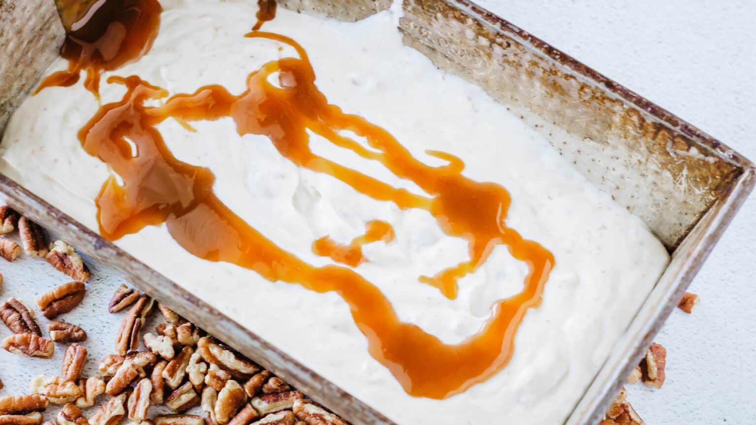 drizzle caramel onto ice cream in loaf pan