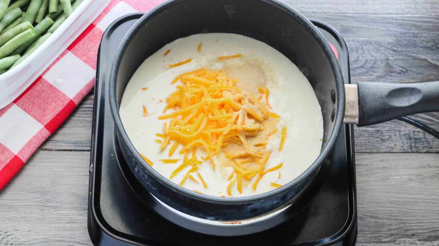 heavy cream, cheeses, and seasonings in a saucepan