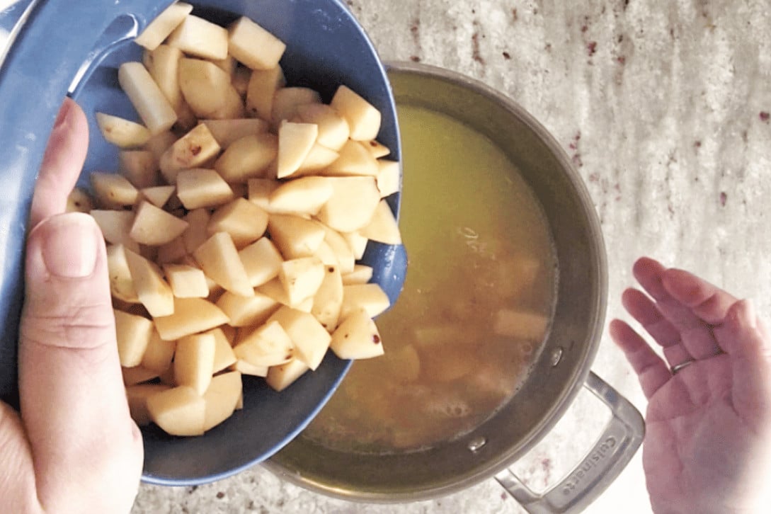 adding potatoes to water